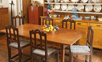 A South African pine and teak dining table, 20th century