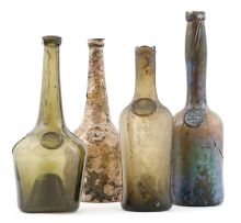 A group of four green glass Constantia wine bottles, 18th century