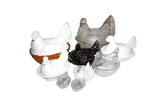 A miscellaneous group of nine glass hen egg baskets