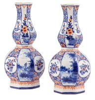 A pair of Dutch Delft iron-red, blue and white vases, 19th century