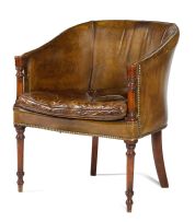 A George III style mahogany and close-nailed leather-upholstered library bergère, 19th century