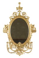 An Adam Revival style gilt and composition wall mirror