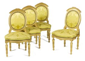 A set of four Louis XVI style giltwood side chairs