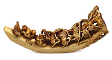 A Chinese carved ivory tusk of a figural group, late 19th century