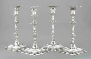 A set of four George III silver table candlesticks, Ebenezer Coker, London, 1764