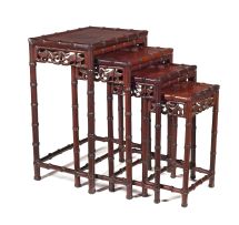 A nest of four Chinese tables