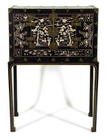 A Korean mother-of-pearl-inlaid lacquered cabinet, Choson Period, 19th century, on later stand
