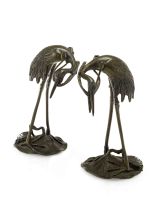 A pair of Japanese bronze candlesticks in the form of cranes, late Meiji Period (1868-1912)
