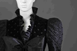 An embroided and quilted black velvet and slik taffeta cocktail dress