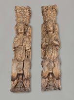 A pair of European carved oak figural pilasters, possibly 17th century