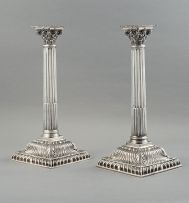 A pair of Edward VII silver Corinthian column candlesticks, CS Harris & Sons Ltd, London, 1904