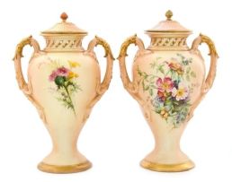 Pair of Royal Worcester vases, finial re-glued and gilded