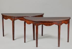 A pair of mahogany demi-lune tables, 19th century