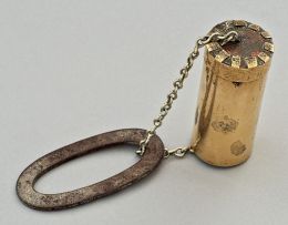 A Cape brass tonteldoos and striker, 19th century