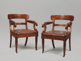 A pair of William IV mahogany and upholstered library armchairs