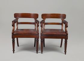 A pair of William IV mahogany and upholstered library armchairs