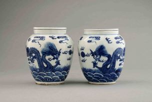 A pair of Chinese blue and white jars and covers