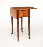 An early Victorian satinwood and mahogany drop-leaf table