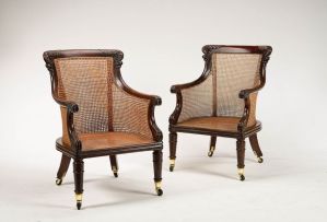 A pair of William IV mahogany and caned bergères