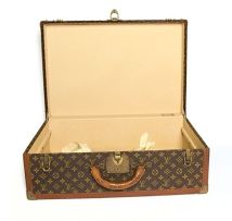 A Louis Vuitton Alzer suitcase in monogram canvas, 20th century