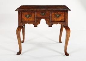 A George II walnut lowboy, 18th century and later