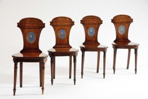A set of four Regency mahogany hall chairs