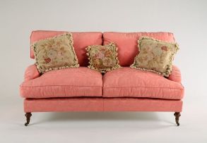 A Victorian style upholstered and mahogany sofa, modern