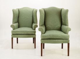 A near pair of George II style mahogany and upholstered armchairs