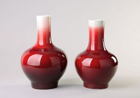 A near pair of Chinese copper-red glazed bottle vases, modern