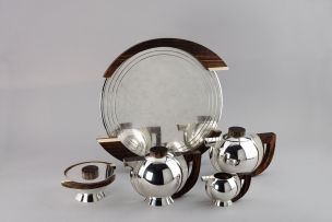 A French Art Deco five-piece electroplate, macassar and ivory tea service, circa 1925