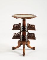 A Victorian walnut revolving book stand
