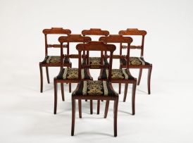 A set of six Regency mahogany and brass-inlaid side chairs