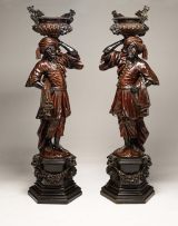 A pair of monumental Venetian parcel-gilt ebonised and carved wood blackamoors, in the manner of Valentino Besarel, second half 19th century
