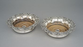 A pair of Sheffield plate wine coasters, 19th century