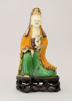 A Chinese sancai-glazed figure of Guanyin, Kangxi, late 17th/early 18th century
