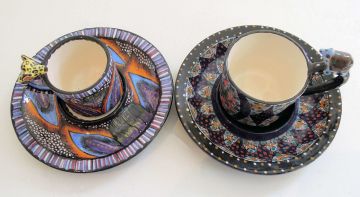 Ardmore Ceramic Studio; Tortoise and Leopard Cups and Saucers, two