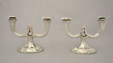 A pair of Austrian silver candlesticks, designed by Alexander Sturm, Vienna, post 1922, .800 standard