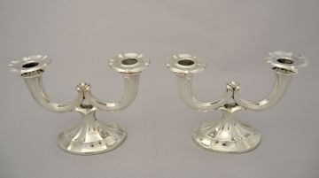 A pair of Austrian silver candlesticks, designed by Alexander Sturm, Vienna, post 1922, .800 standard