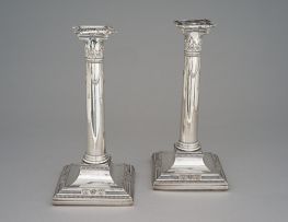 A pair of Sheffield plate candlesticks, 19th century