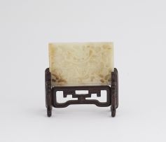 A Chinese carved celadon jade plaque, late 19th/early 20th century