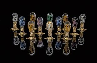 An assembled set of twelve Czechkoslovakian intaglio glass and gilt-metal mounted place-card holders, 1920s