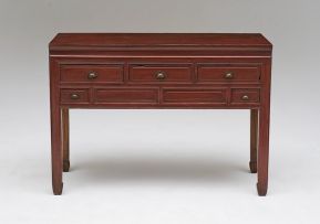 A Chinese red lacquered and fruitwood desk, late 19th/early 20th century