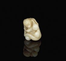 A Chinese pale grey jade carving of a monkey, late 19th/early 20th century
