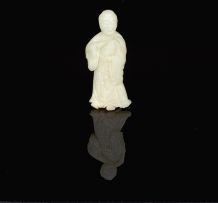 A Chinese pale celadon jade carving of Lu Dongbin, late 19th/early 20th century
