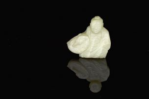A Chinese celadon jade carving of a boy and a swan, late 19th/early 20th century