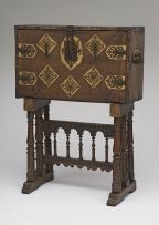 A Spanish iron-mounted parcel-gilt bone and walnut vargueno, 17th century, on later stand