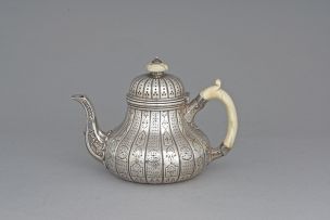 A Victorian silver teapot, Robert Garrard II, London, 1856, retailed by Garrards, Panton Street, London