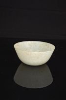 A Chinese carved pale celadon jade bowl, 19th century