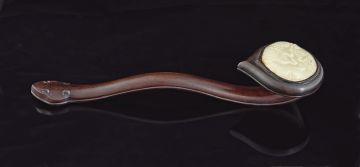 A Chinese hardwood and carved celadon jade inlaid ruyi sceptre, late 19th century