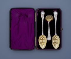 An assembled cased set of two William IV silver-gilt berry spoons, one Charles Lias, the other John Harris V, London, 1837